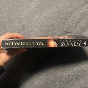 This is a book called “Reflected in you” there is 338 pages,  its by Sylvia Day